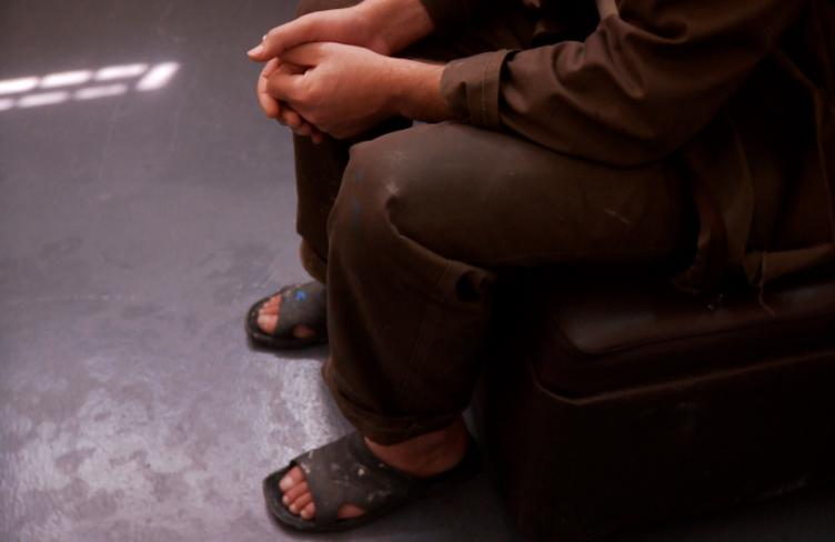 Man sits in cell