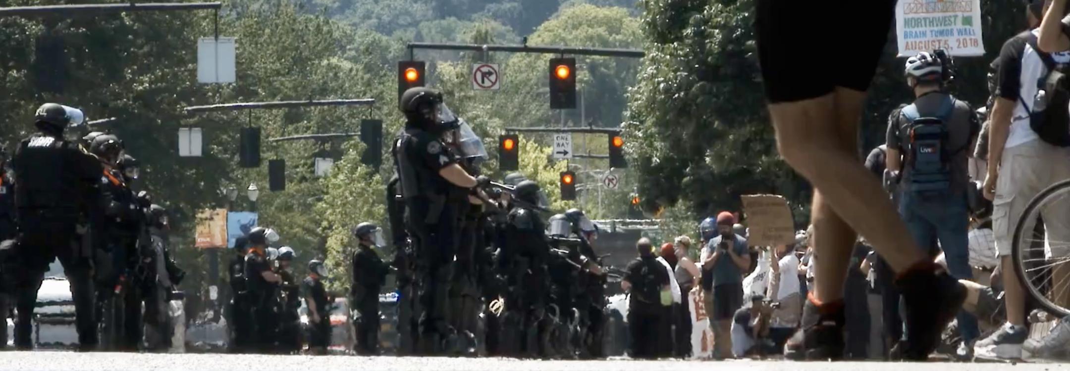 Police and protesters meet in a street in the United States