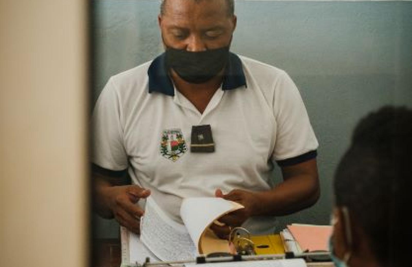 Male officer going through records